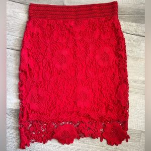 Red pencil skirt with beautiful lace detail. Fits sizes 14/16.